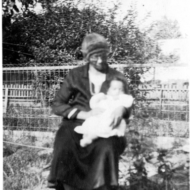 My great-grandmother, Martha Pleasant, holds my father.