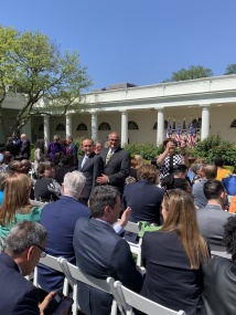 In suits and ties facing the camera: Nicholas Hemachandra and Ray Hemachandra in the Rose Garden on April 18, 2023, before President Biden delivered remarks and signed an Executive Order in support of American care workers and caregivers and the people in their care. (Photo by Julie Ward)